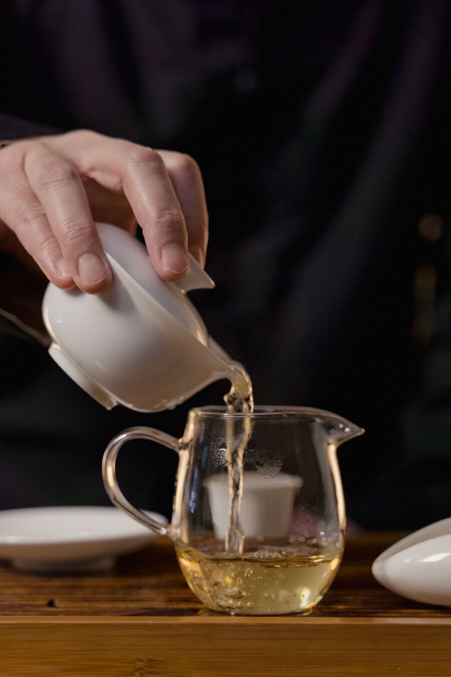 Calming Chinese tea ritual with a gaiwan and glass pitcher