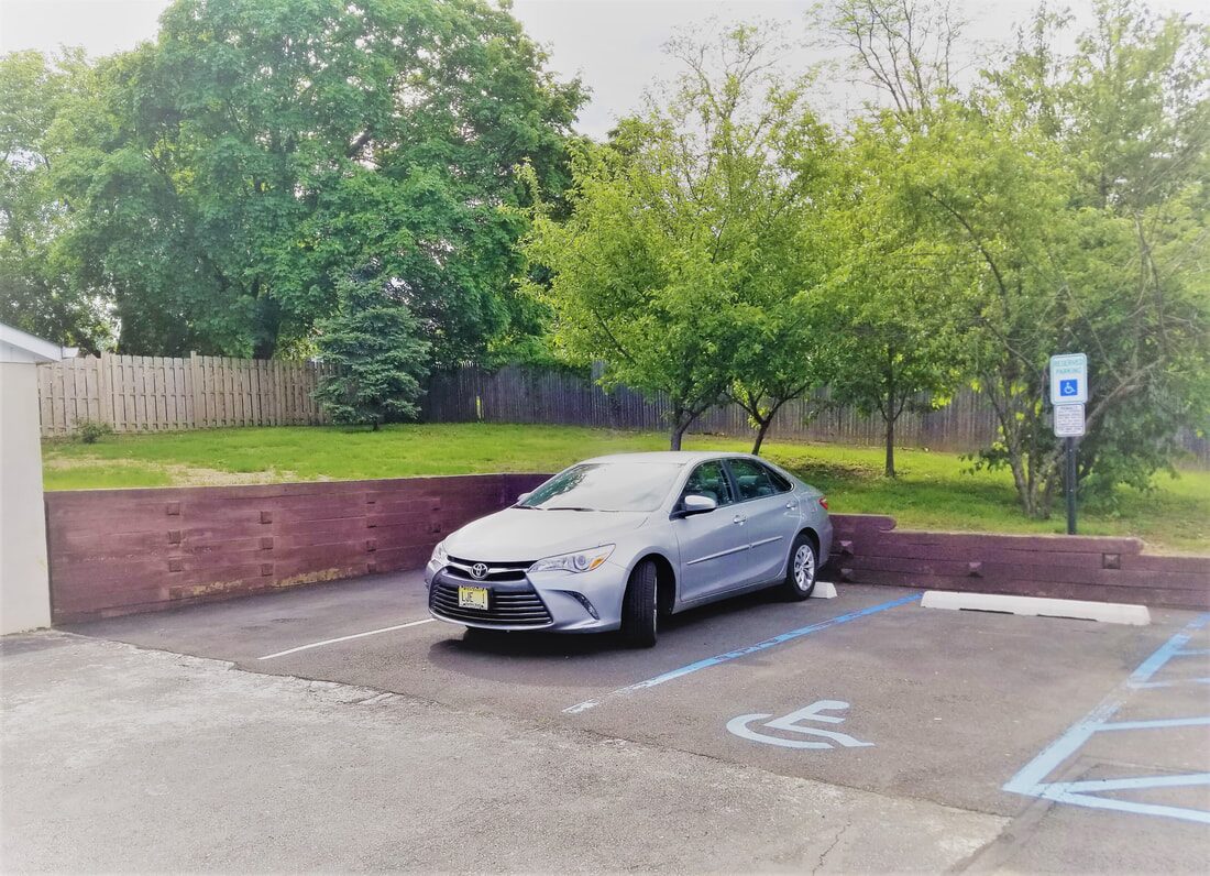 On-site parking lot at the Morristown acupuncture clinic with an accessible parking space